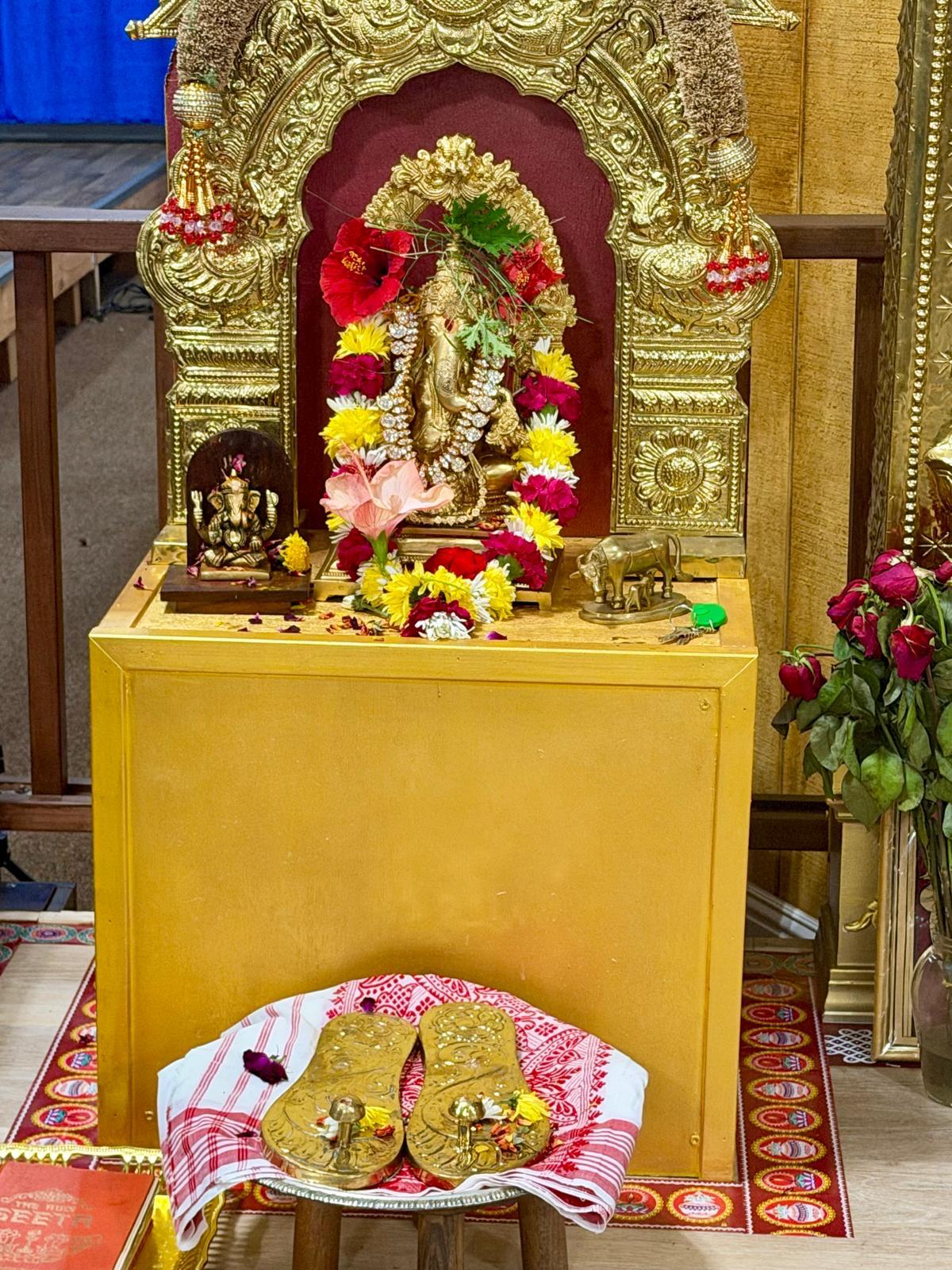 Decorated shrine with flower garlands and offerings at Shankara Mutt