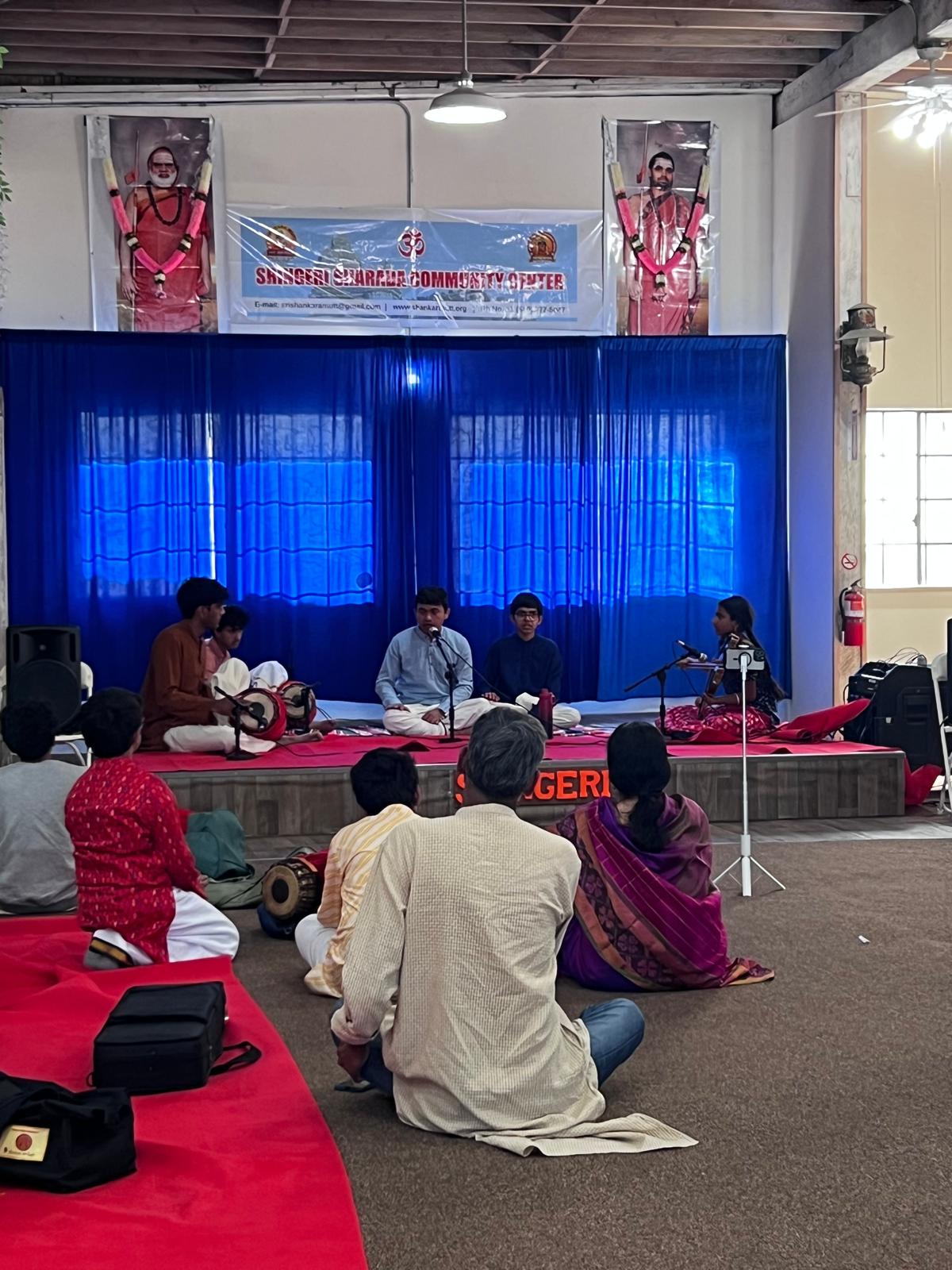 Devotees gathered for music seva in the main hall